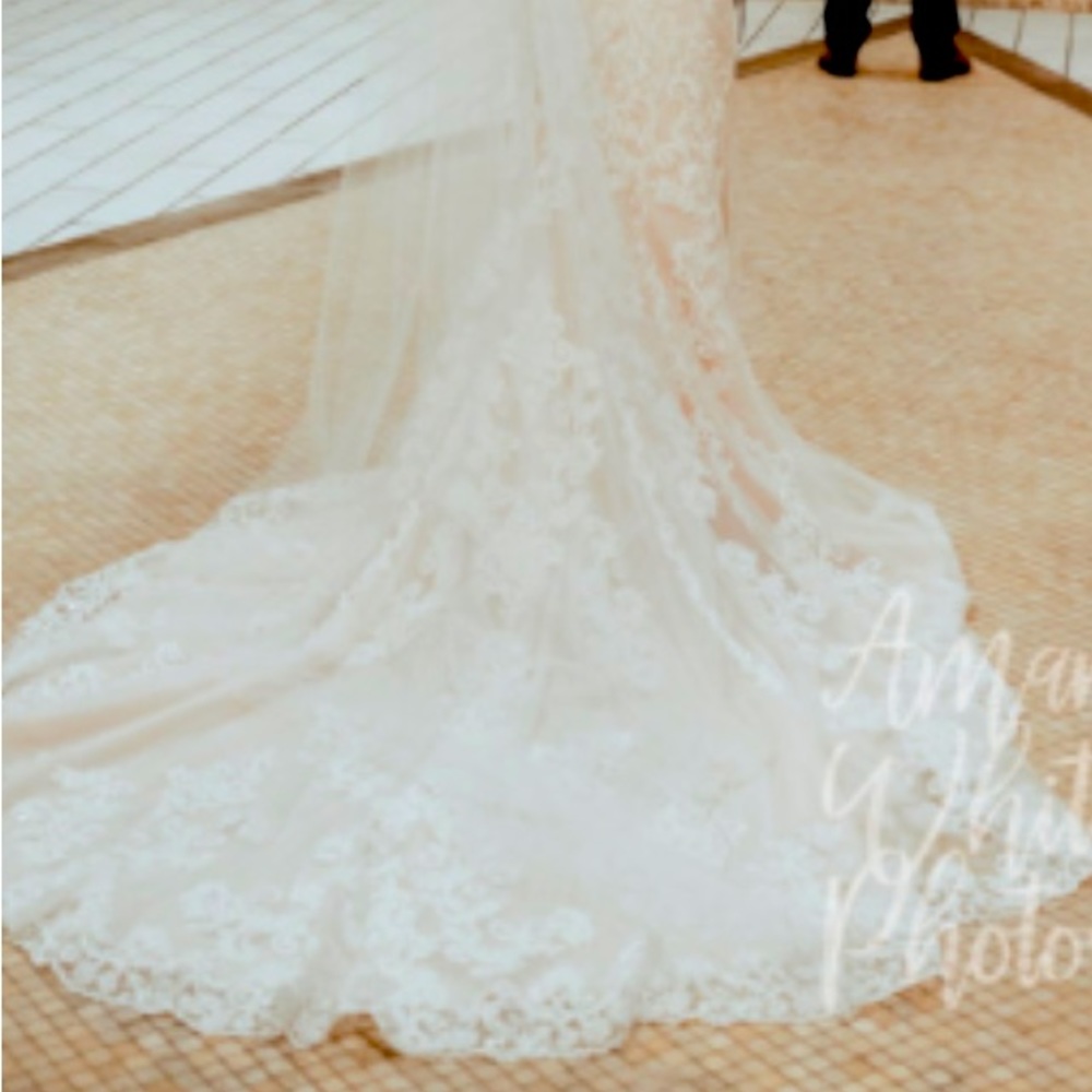 Essence brand. Like new. Size 6. Off white beautiful wedding dress and veil